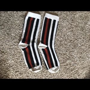 Black, white and burnt orange stripped long socks
